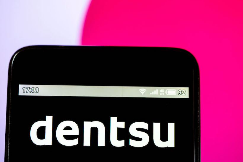 Smart phone displaying Dentsu logo